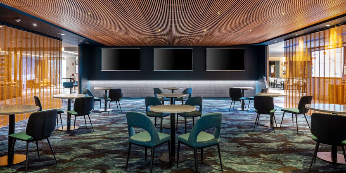 Gold Kriskadecor chain curtain ceiling feature above trees at Regnum Carya